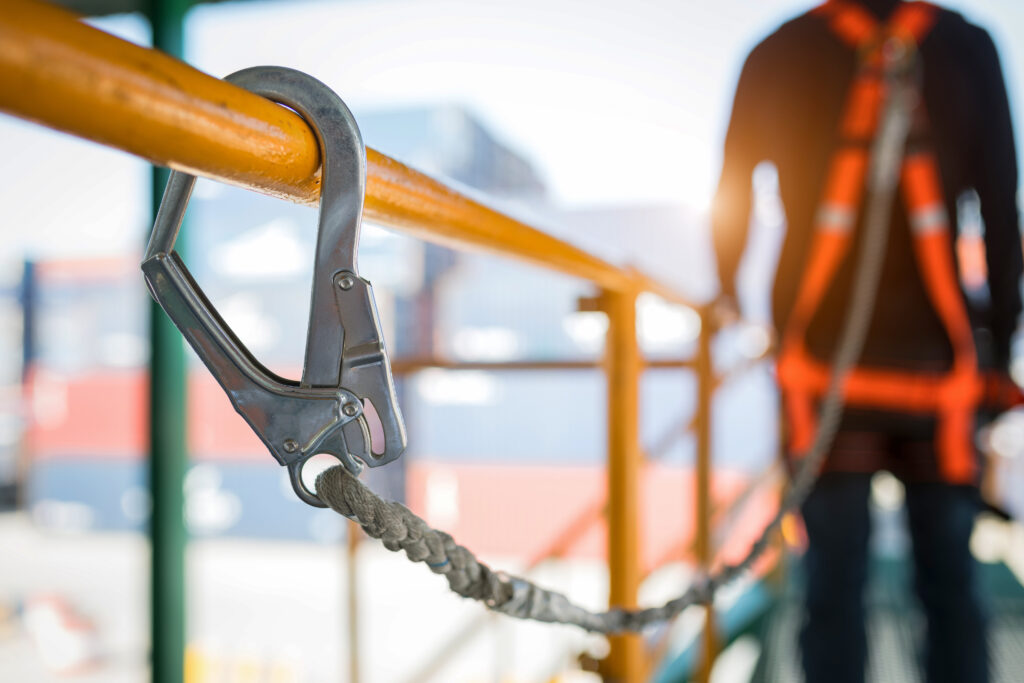 Construction worker wearing safety harness and safety line - BCI-Beachy Construction Inc. | BCI-Construction Inc | Beachy Construction